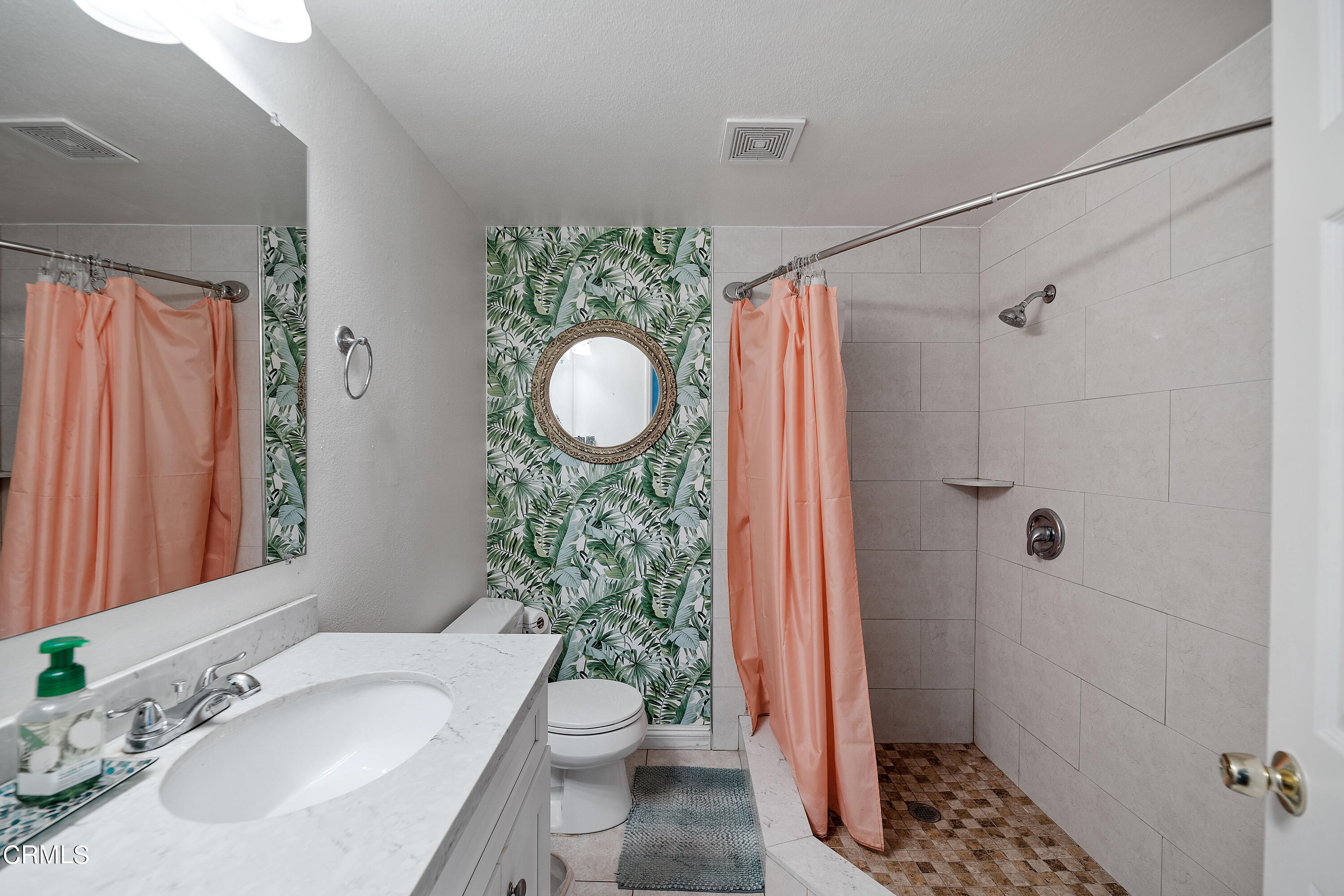 5319 Perkins Road Oxnard, CA 93033 - Photo 8 of 24 a bathroom with a sink toilet and shower