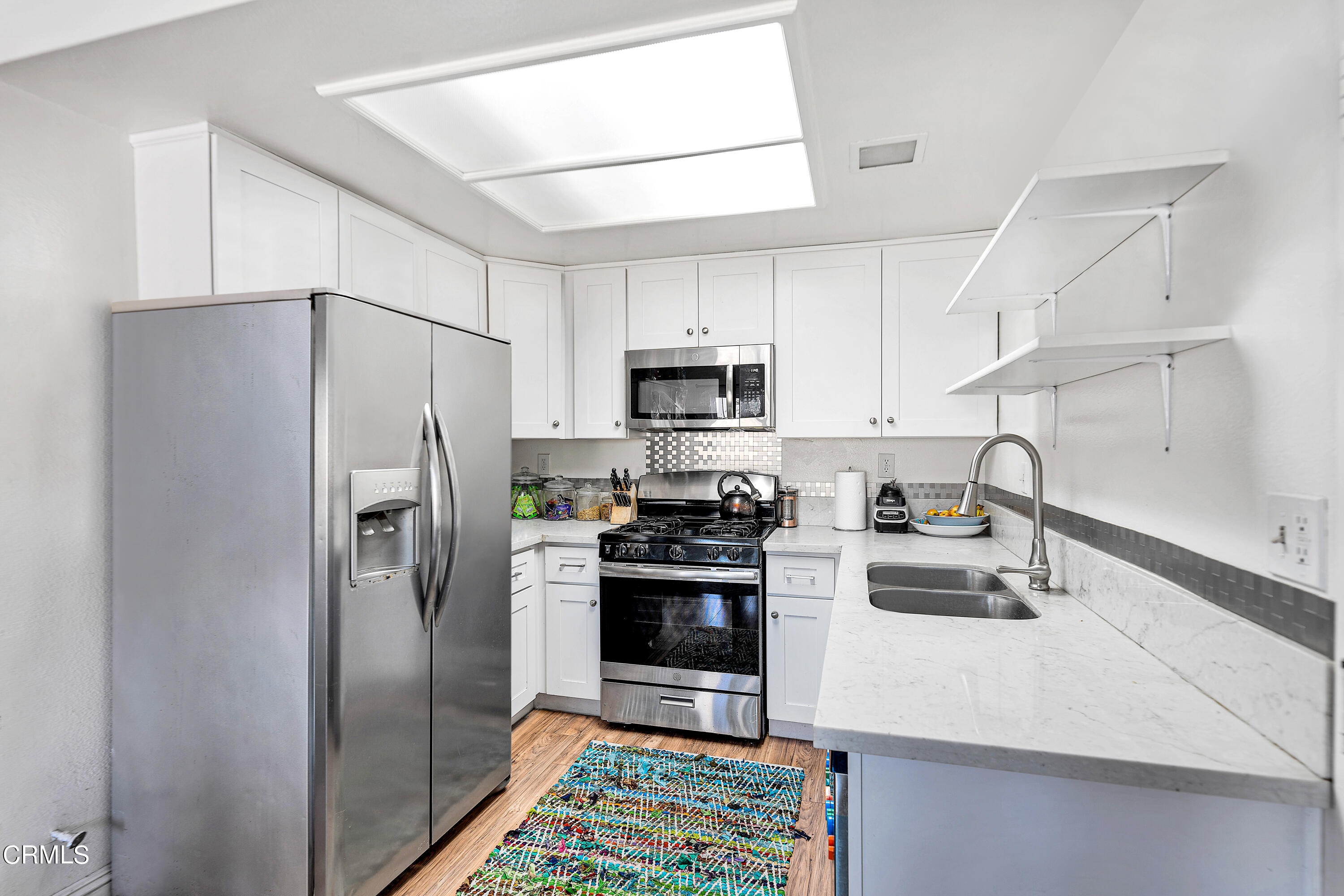 5319 Perkins Road Oxnard, CA 93033 - Photo 10 of 24 a kitchen with stainless steel appliances granite countertop a refrigerator sink and stove