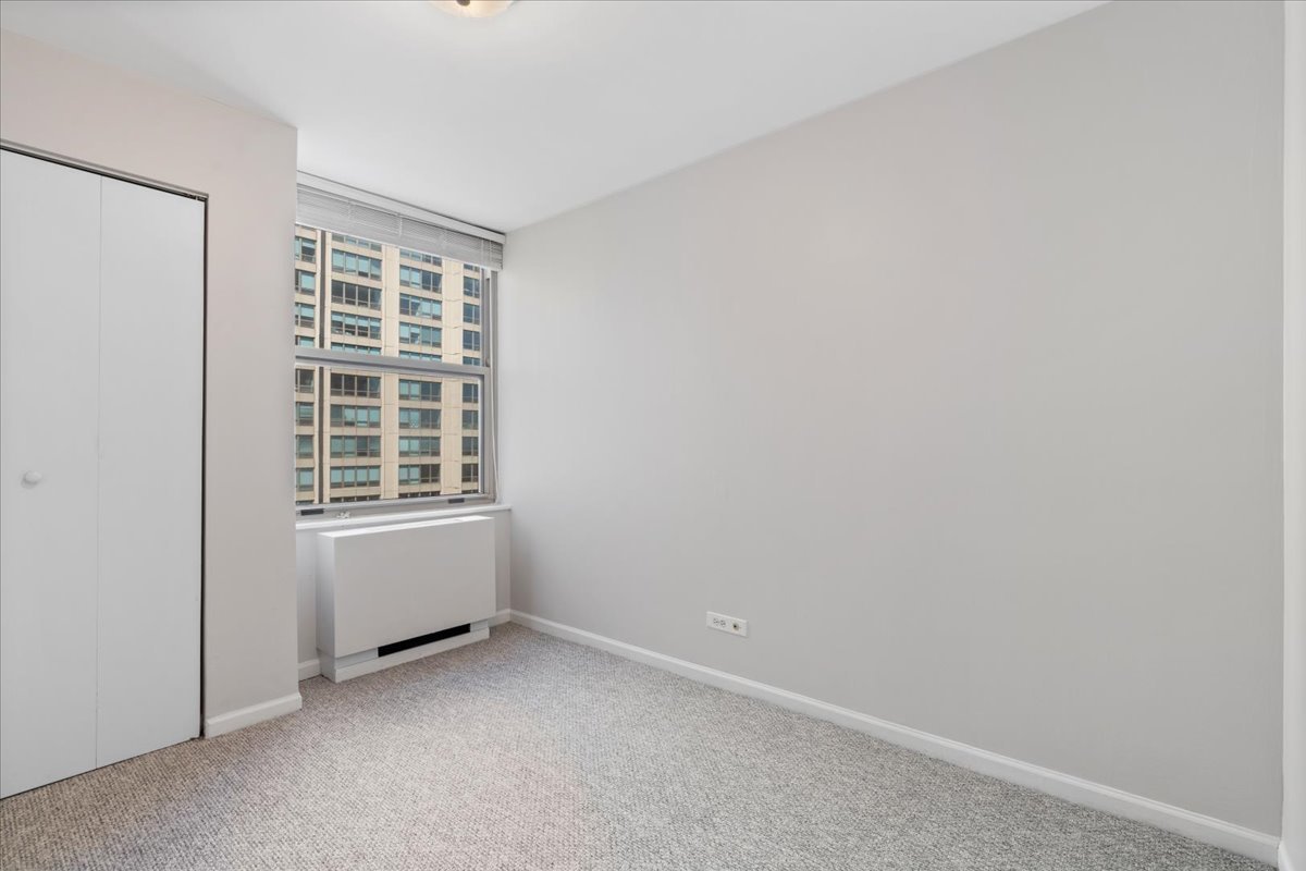 525 West Hawthorne Place, Unit 808 Chicago, IL 60657 - Photo 19 of 29 a view of an empty room with a window