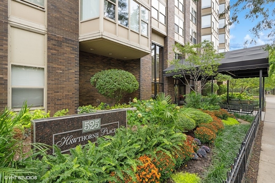 525 West Hawthorne Place, Unit 808 Chicago, IL 60657 - Photo 2 of 29 a view of a house with a yard and plants