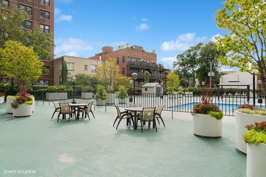 525 West Hawthorne Place, Unit 808 Chicago, IL 60657 - Photo 26 of 29 a view of a patio with couches table and chairs and potted plants