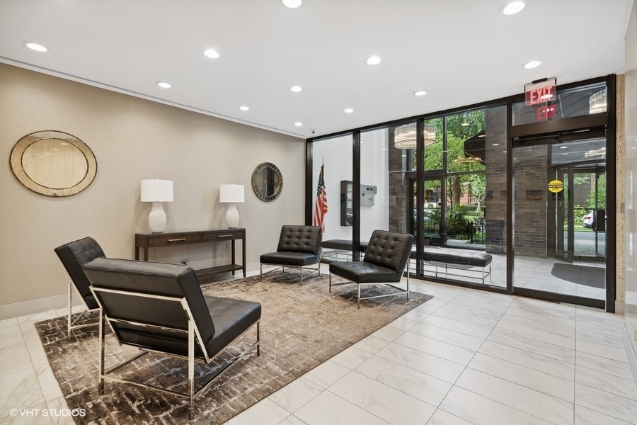 525 West Hawthorne Place, Unit 808 Chicago, IL 60657 - Photo 4 of 29 a living room with furniture and floor to ceiling window