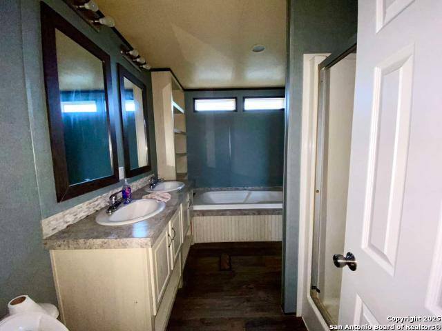 13009 Annette Road Angleton, TX 77515 - Photo 14 of 14 a bathroom with a double vanity sink and mirror