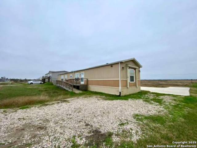 13009 Annette Road Angleton, TX 77515 - Photo 5 of 14 a backyard of a house with lots of green space