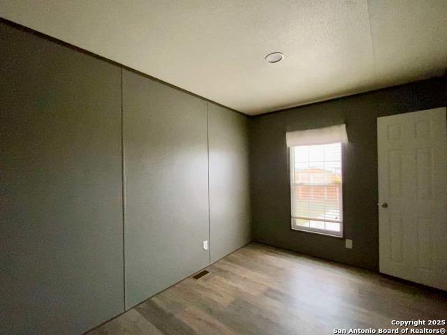 13009 Annette Road Angleton, TX 77515 - Photo 9 of 14 an empty room with windows