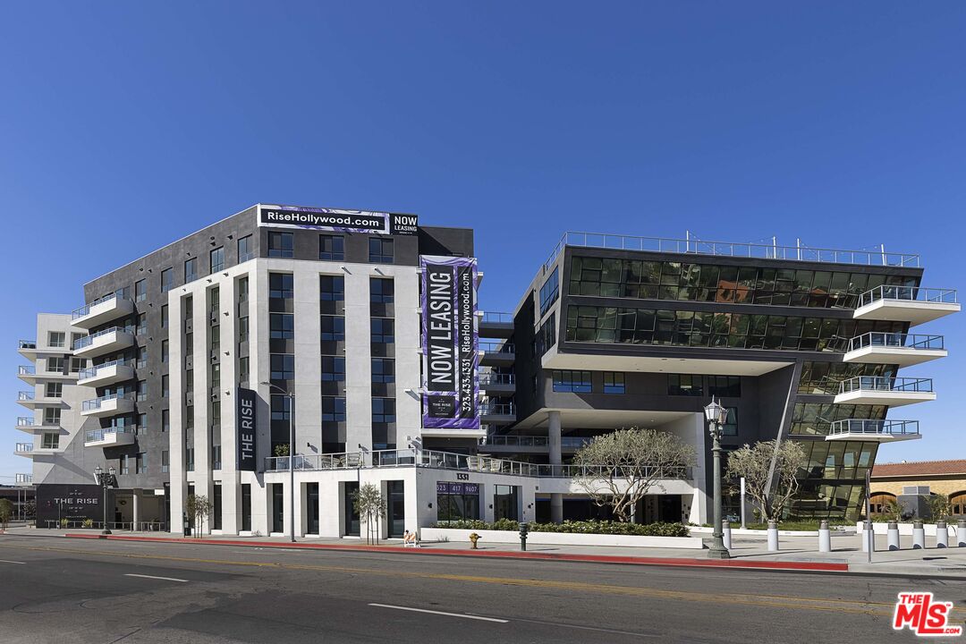 1331 North Cahuenga Boulevard, Unit 5213 Los Angeles, CA 90028 - Photo 1 of 44 a front view of a building with a street