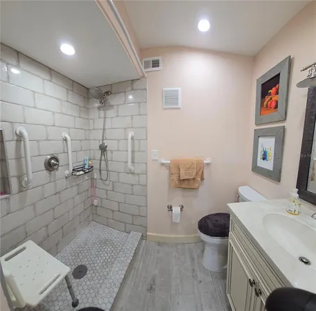 a bathroom with a sink toilet and shower
