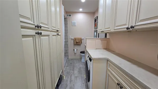 a view of storage and utility room with racks on the wall