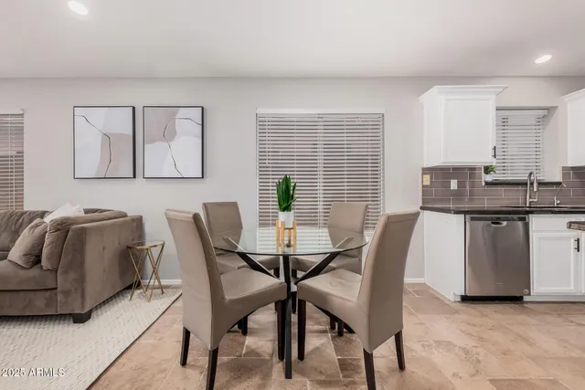 a view of a dining room with furniture and window