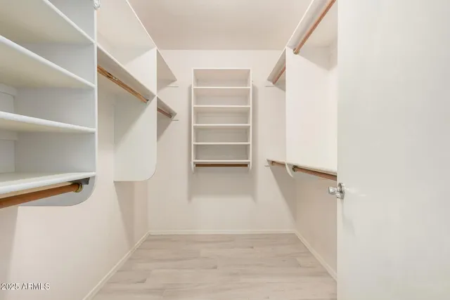 a bathroom with a shower and a mirror
