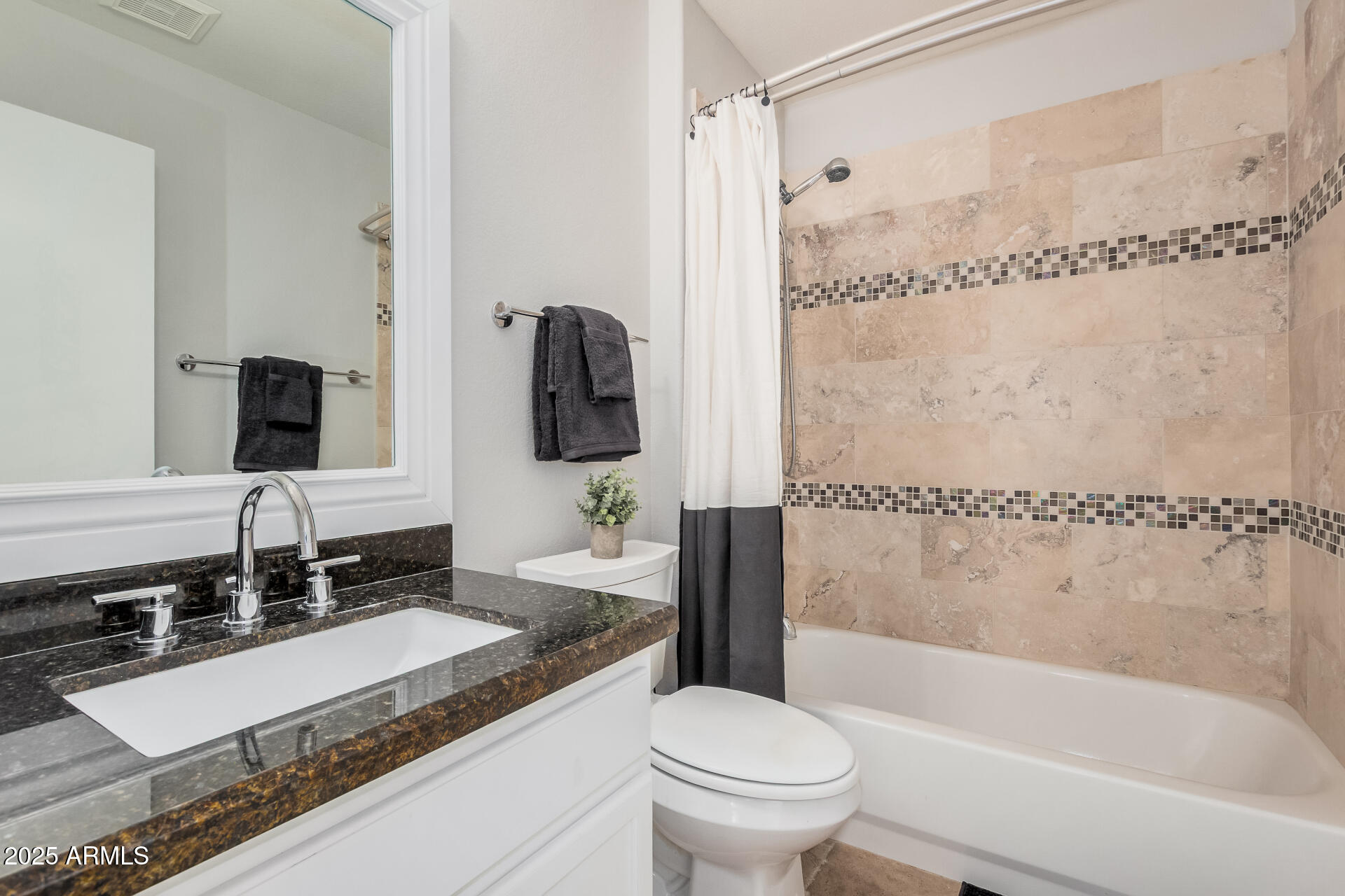 4632 East Mossman Road Phoenix, AZ 85050 - Photo 19 of 24 a bathroom with a granite countertop sink toilet and shower