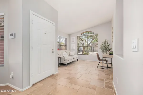 a living room with furniture and a window