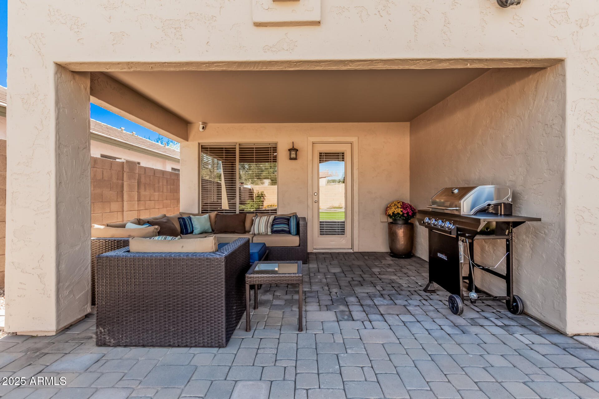 4632 East Mossman Road Phoenix, AZ 85050 - Photo 22 of 24 a living room with furniture and a window