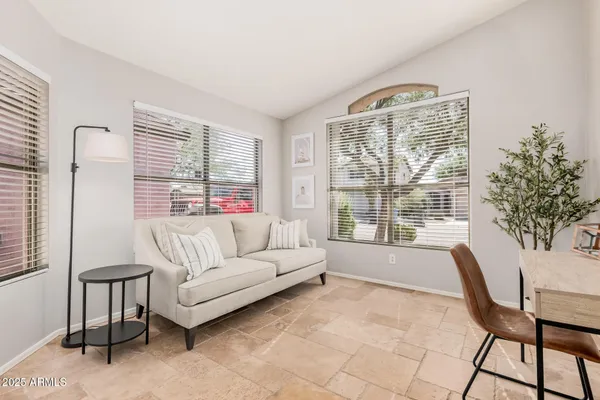 a living room with furniture and a large window
