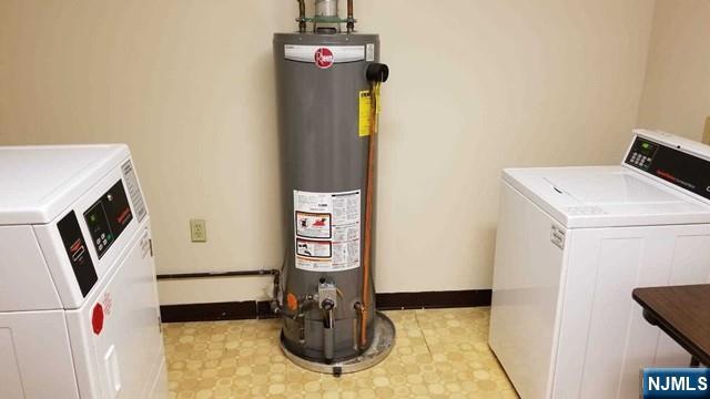 290 Anderson Street, Unit 6I Hackensack, NJ 07601 - Photo 11 of 12 a bathroom with a sink and washing machine