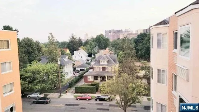 a view of multiple houses with a street