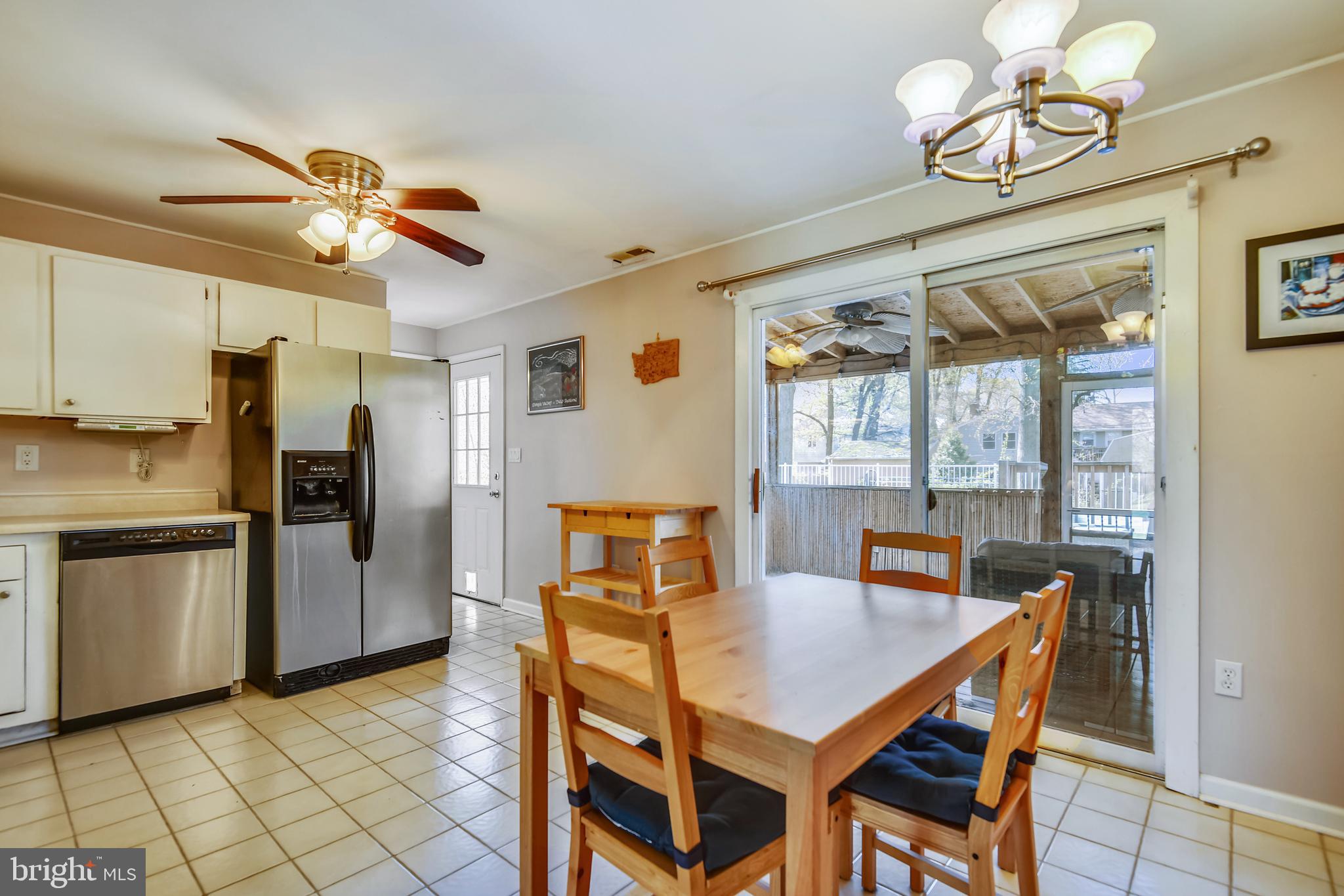 552 Sunset Knoll Road Pasadena, MD 21122 - Photo 10 of 36 a view of a dining room with furniture window and wooden floor