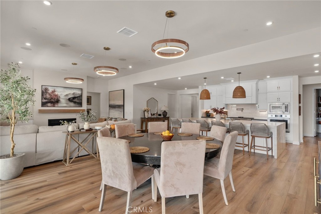 16155 New Canaan Court Riverside, CA 92504 - Photo 15 of 26 a view of a dining room with furniture and wooden floor