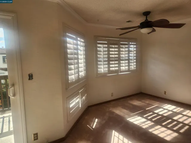 a view of an empty room and window
