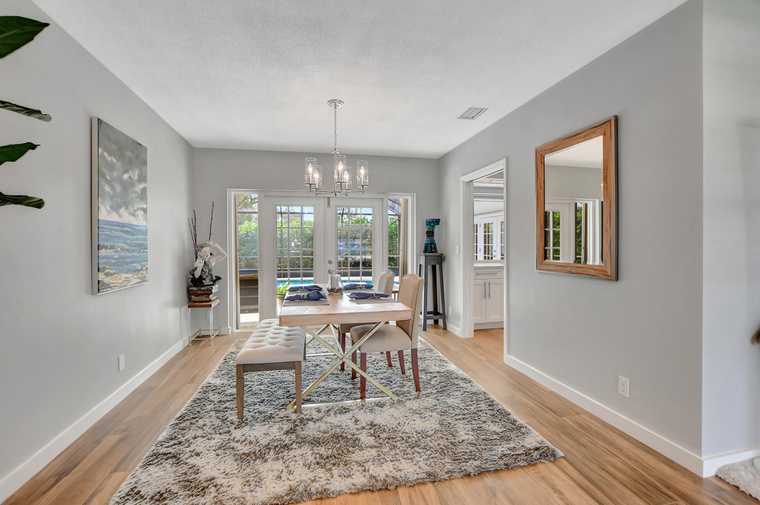 510 Silver Lane Boca Raton, FL 33432 - Photo 4 of 24 a living room with furniture and a chandelier