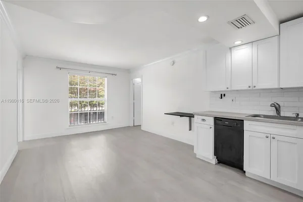a view of a kitchen with electric appliances