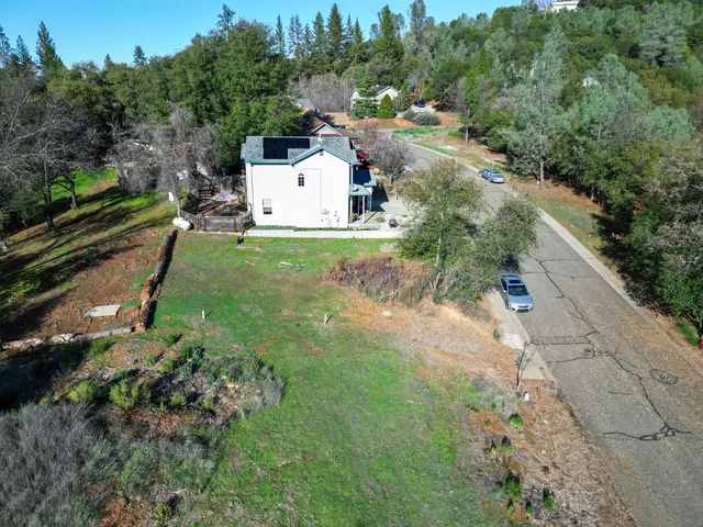 an aerial view of residential house with outdoor space