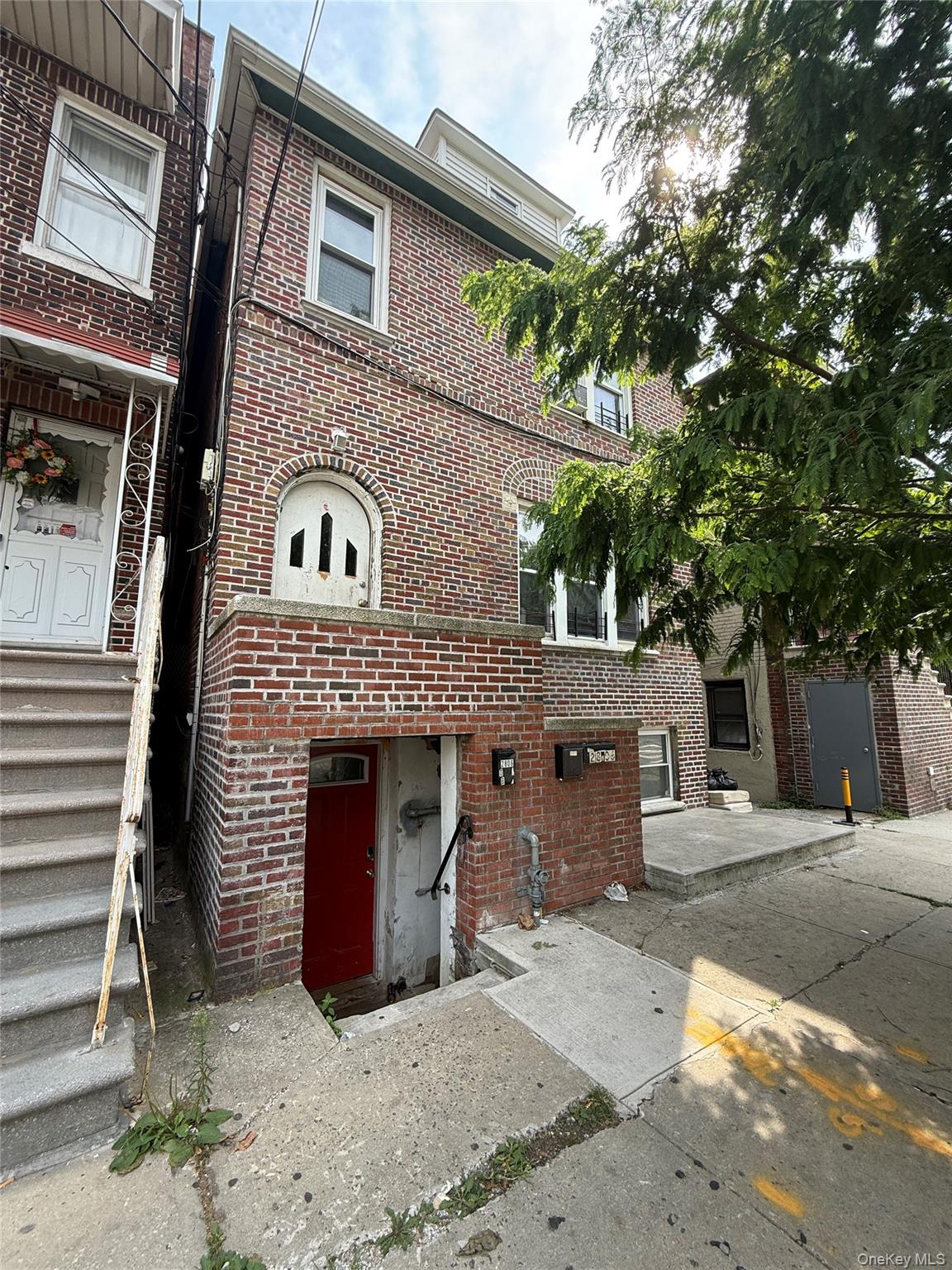 2806 Wellman Avenue Bronx, NY 10461 - Photo 12 of 14 a view of a house with a patio and a yard