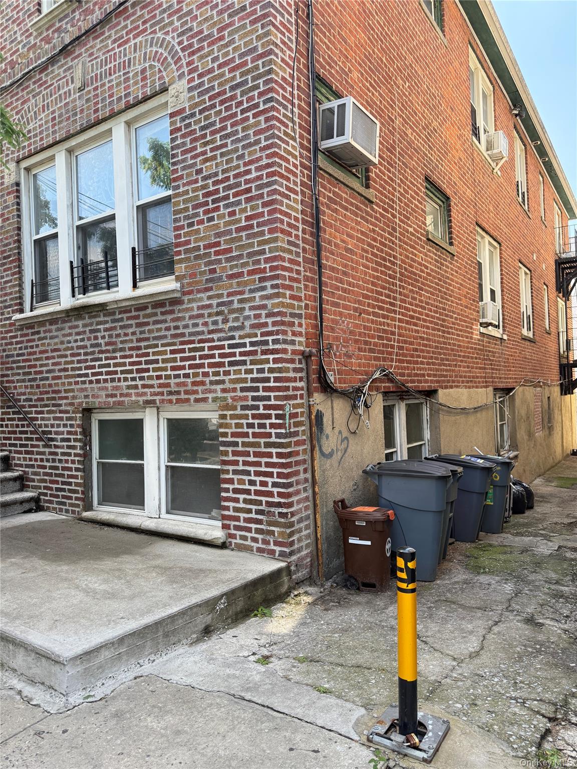 2806 Wellman Avenue Bronx, NY 10461 - Photo 3 of 14 a front view of a building with parking area