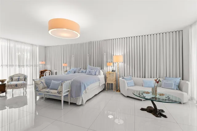 a bed room with a bed and a chair