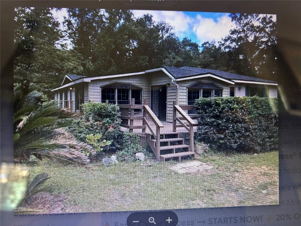 86163 Jean Road Yulee, FL 32097 - Photo 1 of 1 front view of a house with a yard