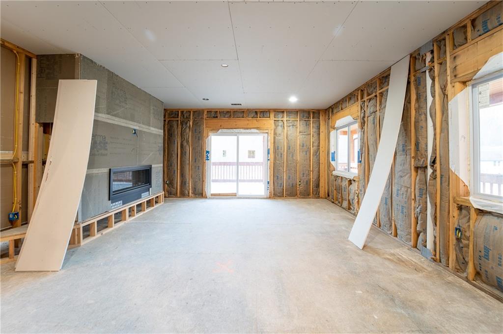 337 Chestnut Ridge Road Latrobe, PA 15650 - Photo 17 of 25 a view of an empty room with a fireplace and a window