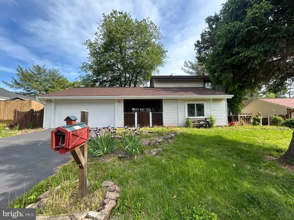 a front view of house with yard and seating area
