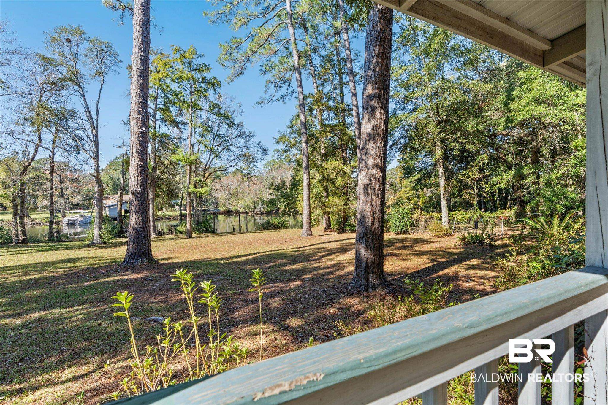 431 Simms Drive Saraland, AL 36571 - Photo 18 of 34 View of yard featuring a balcony and view of scattered trees