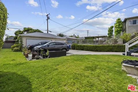 a view of a backyard with sitting area