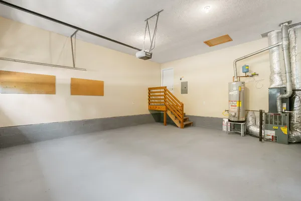 a view of a hallway with wooden floor and entryway