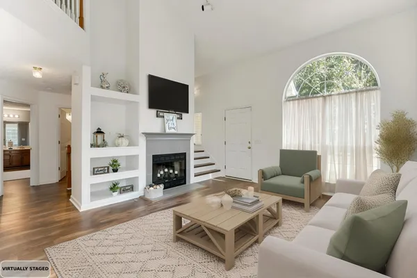 an empty room with window and wooden floor