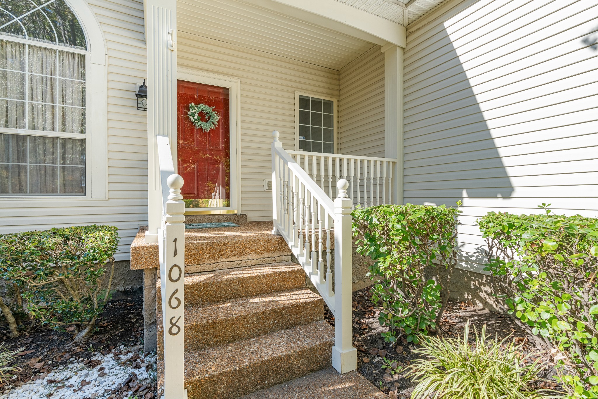 1068 Tulip Grove Road Hermitage, TN 37076 - Photo 3 of 100 a view of a pathway of a house with plants and wooden floor