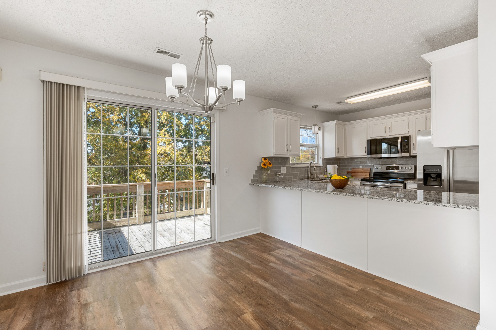 1068 Tulip Grove Road Hermitage, TN 37076 - Photo 33 of 100 a view of a kitchen with stainless steel appliances granite countertop a refrigerator stove top oven and cabinets