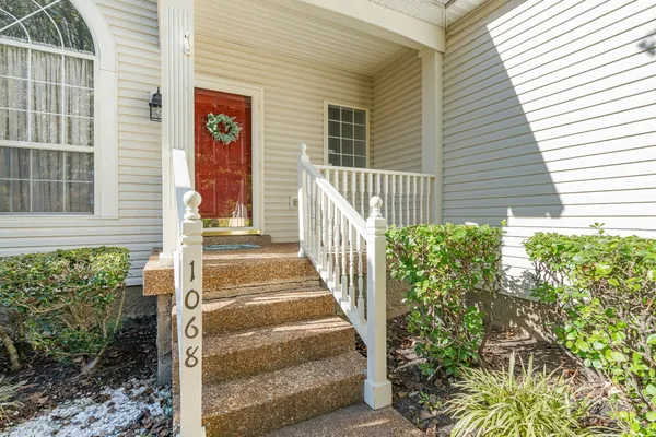 a view of a house with a door and wooden floor