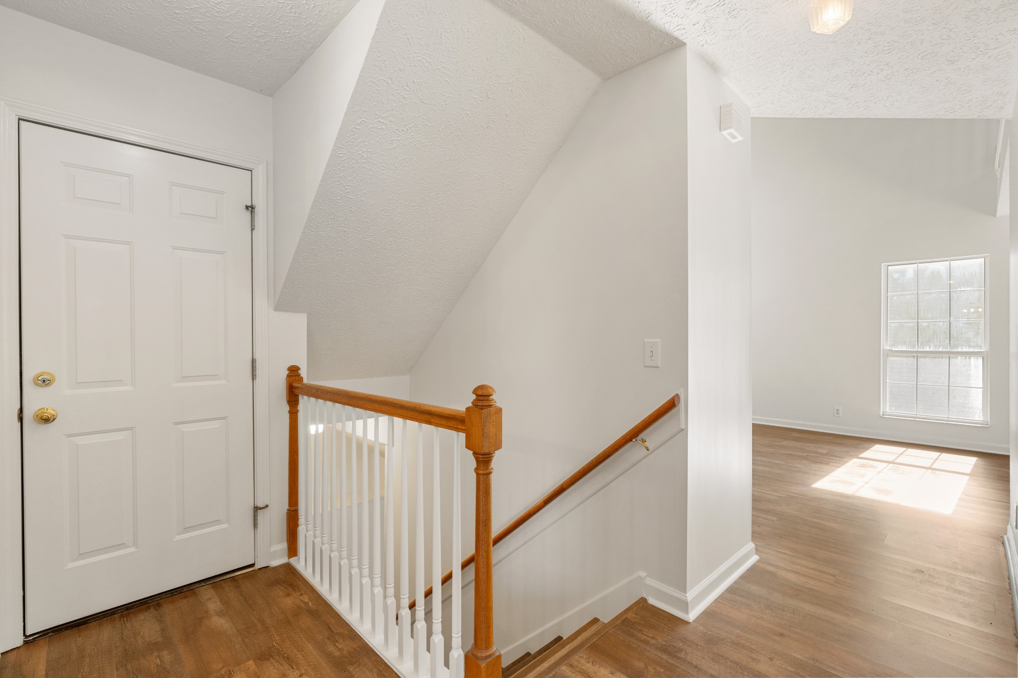 1068 Tulip Grove Road Hermitage, TN 37076 - Photo 51 of 100 a view of a hallway with wooden floor and entryway