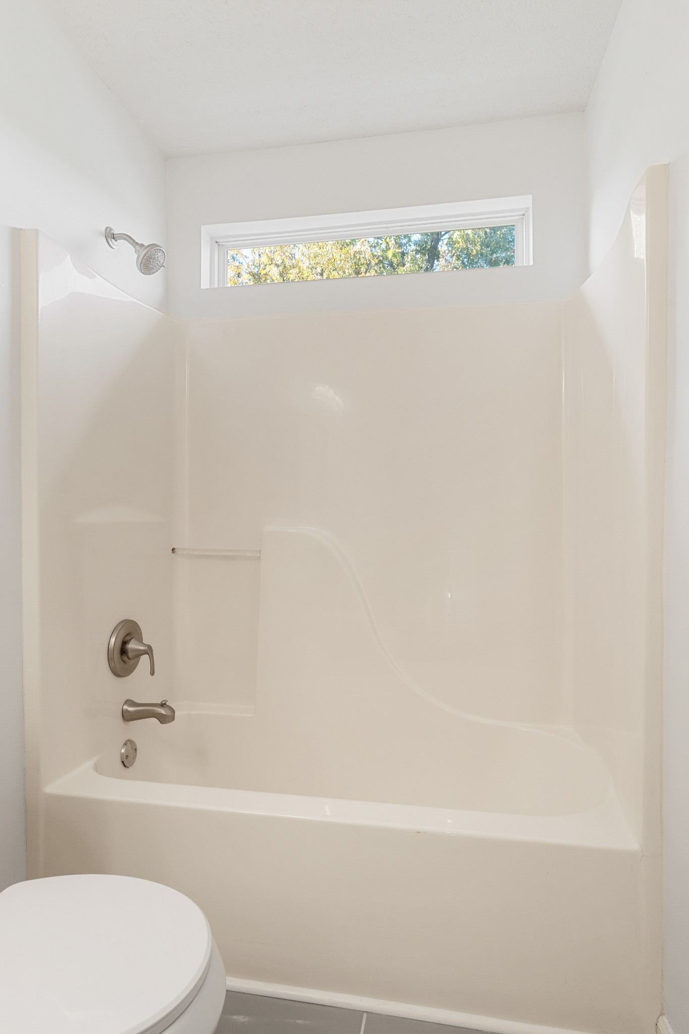 1068 Tulip Grove Road Hermitage, TN 37076 - Photo 66 of 100 a bathroom with a toilet and a bathtub