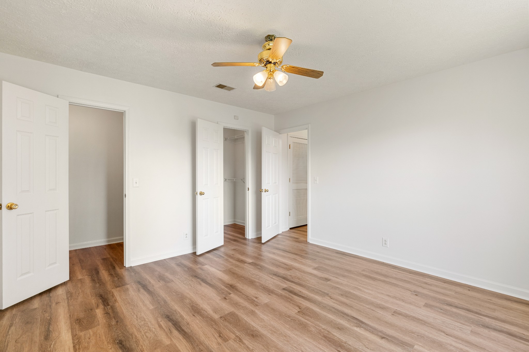 1068 Tulip Grove Road Hermitage, TN 37076 - Photo 72 of 100 a view of an empty room with wooden floor and a window