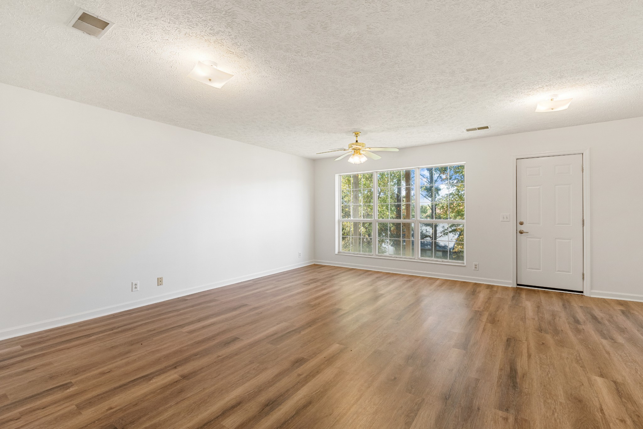 1068 Tulip Grove Road Hermitage, TN 37076 - Photo 78 of 100 wooden floor in an empty room with a window