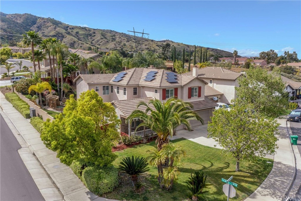 23537 Cantara Road Corona, CA 92883 - Photo 1 of 60 an aerial view of a house with a garden