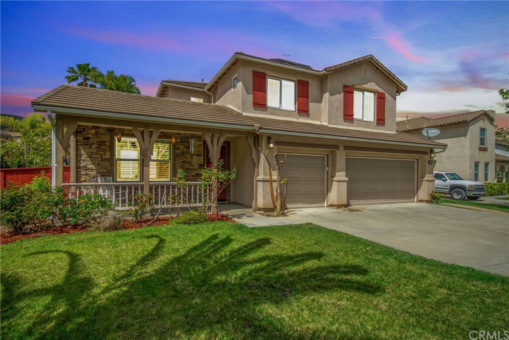 23537 Cantara Road Corona, CA 92883 - Photo 13 of 60 front view of a house with a yard