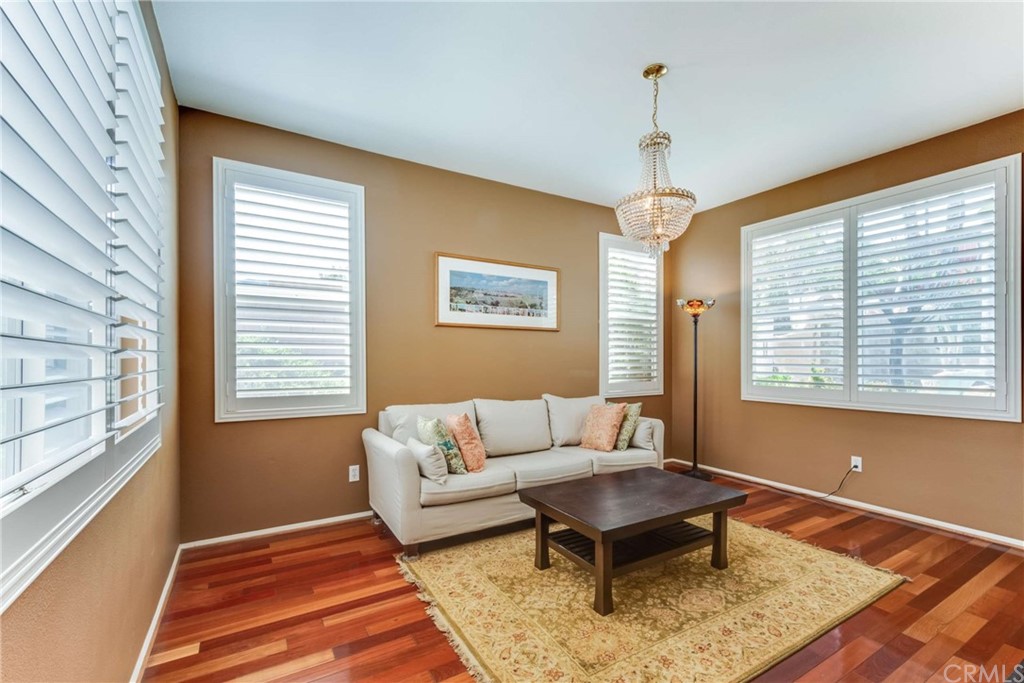 23537 Cantara Road Corona, CA 92883 - Photo 19 of 60 a living room with furniture and a window