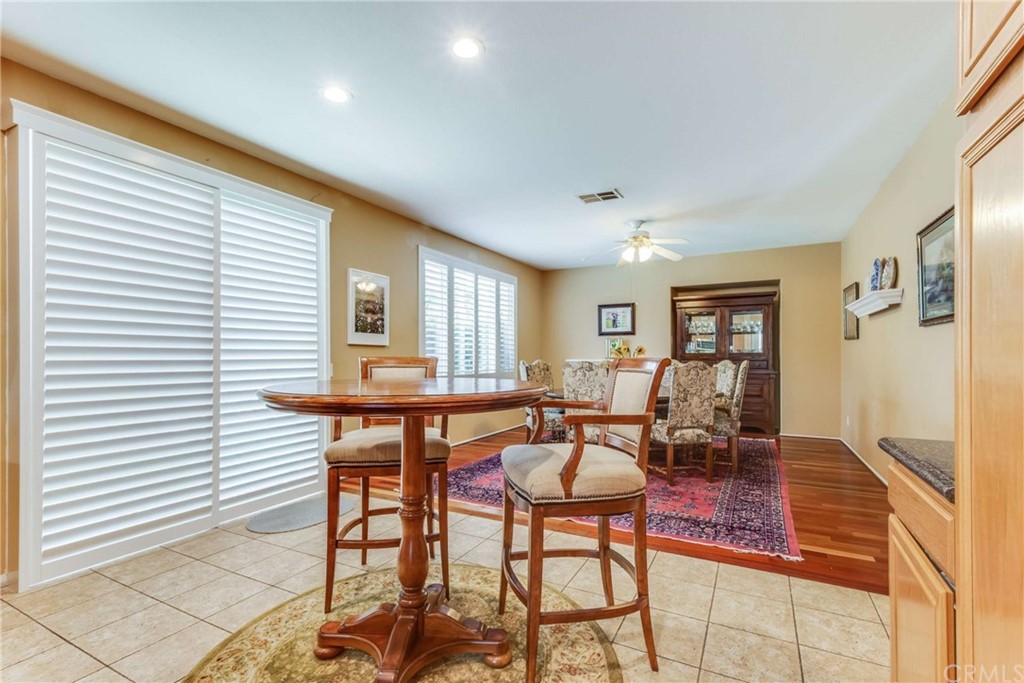 23537 Cantara Road Corona, CA 92883 - Photo 24 of 60 a dining room with furniture and window