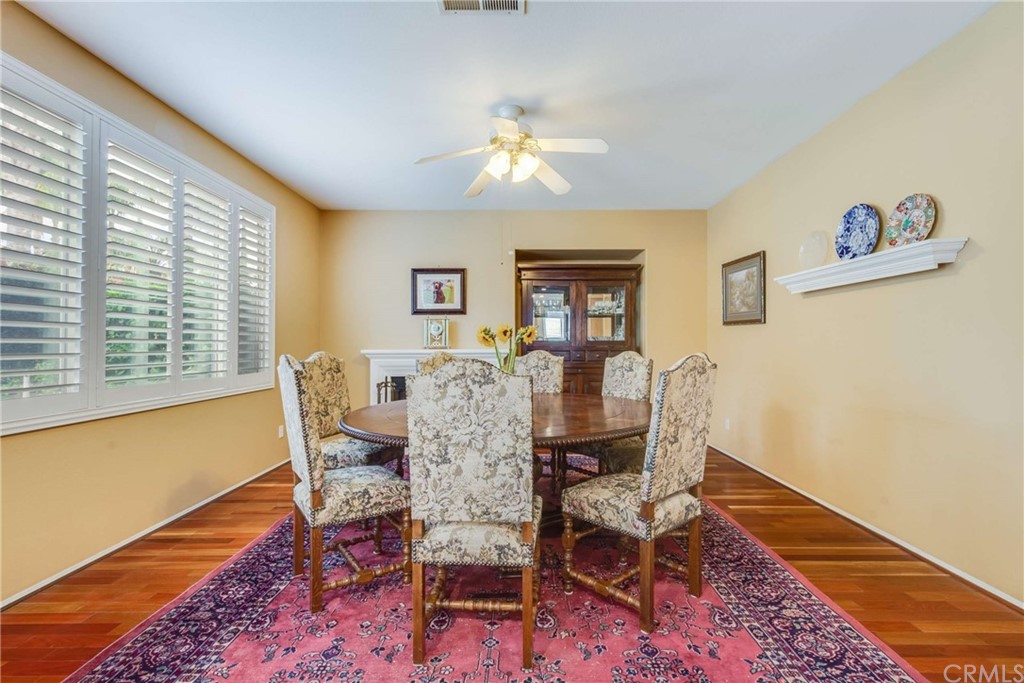 23537 Cantara Road Corona, CA 92883 - Photo 25 of 60 a dining room with furniture and window