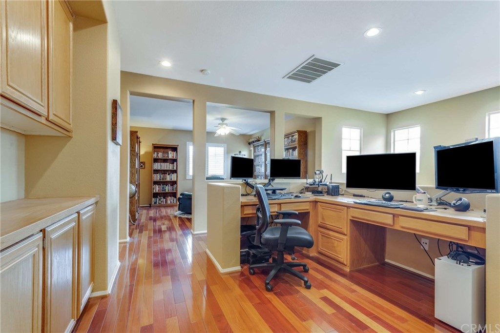 23537 Cantara Road Corona, CA 92883 - Photo 34 of 60 a view of a workspace with furniture and wooden floor