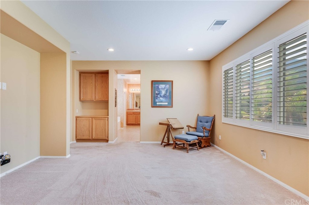 23537 Cantara Road Corona, CA 92883 - Photo 40 of 60 a view of a livingroom with furniture and a window